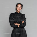 Elegant Woman in Black Dress with Statement Earrings
