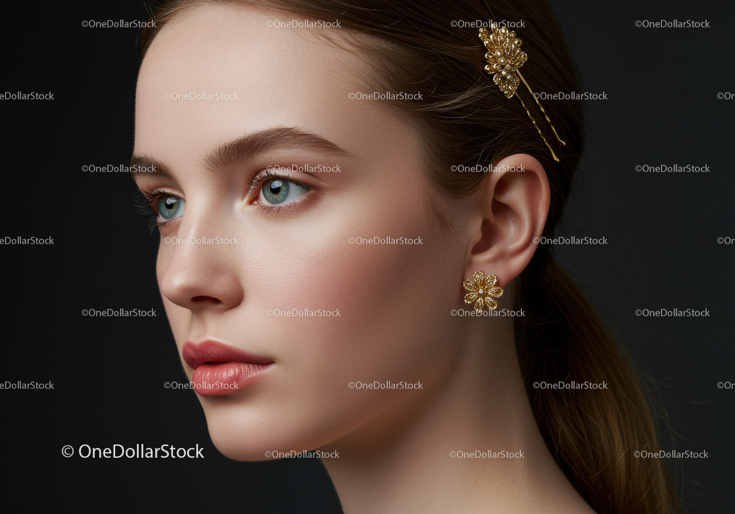 Elegant Woman with Gold Jewelry and Floral Hair Accessory in Close-Up Portrait
