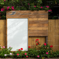Wooden signboard with colorful flowers and bamboo fence