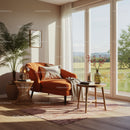 Cozy reading nook with orange armchair and natural light