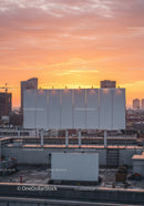 Urban Rooftop Scene Against Vibrant Sunset Sky