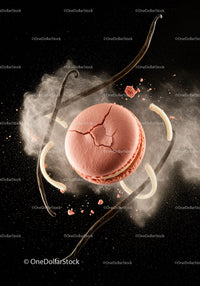 Cracked pink macaron surrounded by vanilla pods and powder