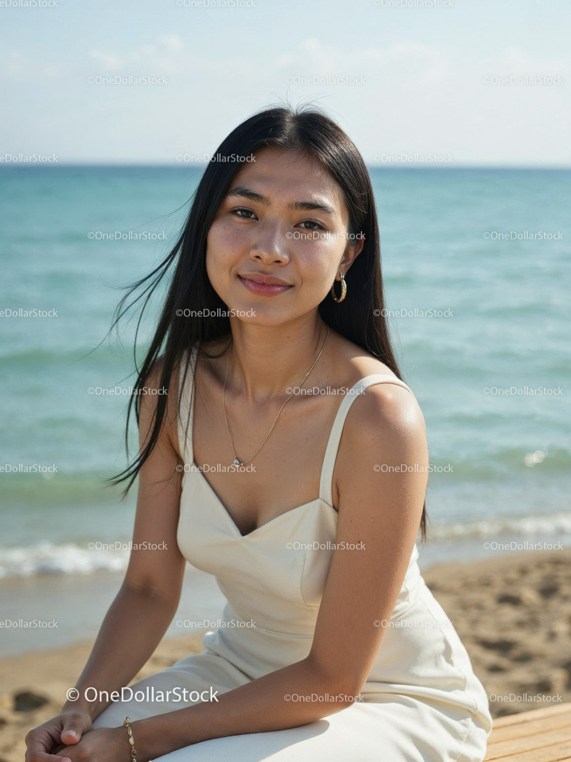 Elegant Woman in White Dress Sitting by Relaxing Seaside Landscape