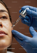 Close-up of Woman Receiving Facial Skincare Treatment with Serum Dropper