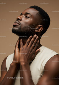 Majestic African Man Applying Facial Moisturizer for Healthy Skin