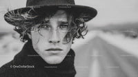 Stylish Male Model with Curly Hair Outdoors in Black and White