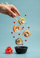 Hand Picking Colorful Sushi Rolls with Chopsticks