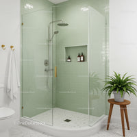 Modern glass shower with green tiles and natural decor