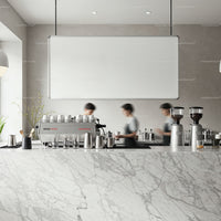 Busy Baristas Preparing Coffee Behind Marble Counter