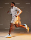 Focused young man running fast in athletic wear