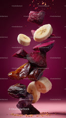 Flying Dried Dates and Banana Slices in Vibrant Pink Background
