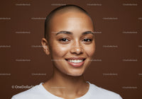 Portrait of a Smiling Bald Woman with Freckles and Clear Skin