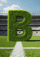 Large Grass Letter B on Soccer Field with Stadium Crowd