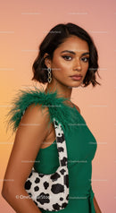 Elegant Woman in Green Dress with Animal Print Bag and Feather Details