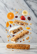 Granola bar with fresh fruit and yogurt on marble