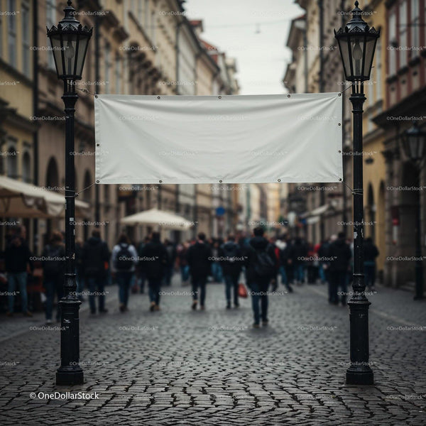Empty white banner between vintage street lamps downtown JPG Mockup Image