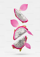 Fresh dragon fruit slices with pink petals floating