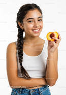 Young Woman Smiling and Holding Peach on White Background