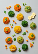 Colorful vegetable and fruit purees with fresh greens