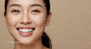 Close up of happy young woman with bright smile