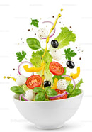 Fresh colorful salad ingredients falling into bowl with olive oil