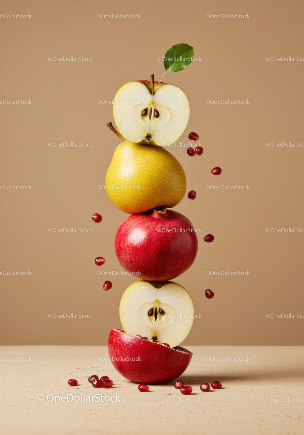 Stacked fresh apples and pear with pomegranate seeds