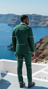 Man in Green Suit Overlooking Scenic Ocean Cliffs