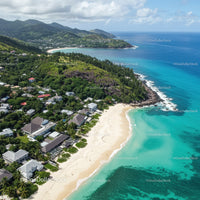 Tropical Beach with White Sand and Turquoise Waters Overlooking Mountain Hills