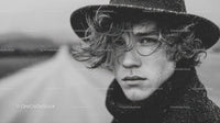 Stylish Man with Curly Hair in Rainy Weather Fashion Portrait