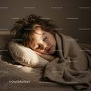 Peaceful toddler sleeping wrapped in cozy blanket