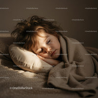 Peaceful toddler sleeping wrapped in cozy blanket