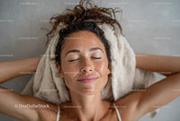 Relaxed Woman Enjoying Skincare Routine with Glowing Skin