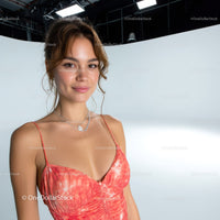 Young Woman Smiling in Summer Pink Dress with Necklace