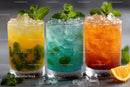 Bright Summer Cocktails with Fruit and Mint in Colorful Glasses