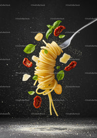 Floating spaghetti fork with sun-dried tomatoes and basil