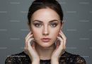Elegant Woman with Blue Eyes and Clear Skin Portrait