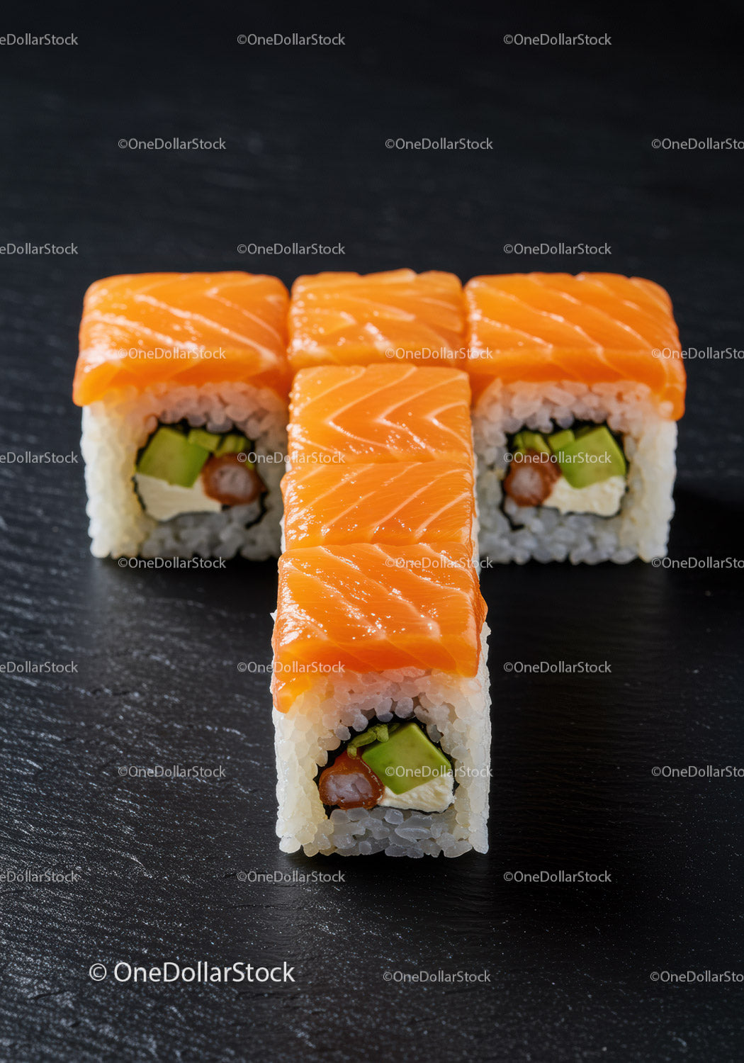 Fresh Salmon Sushi Rolls with Avocado on Black Plate