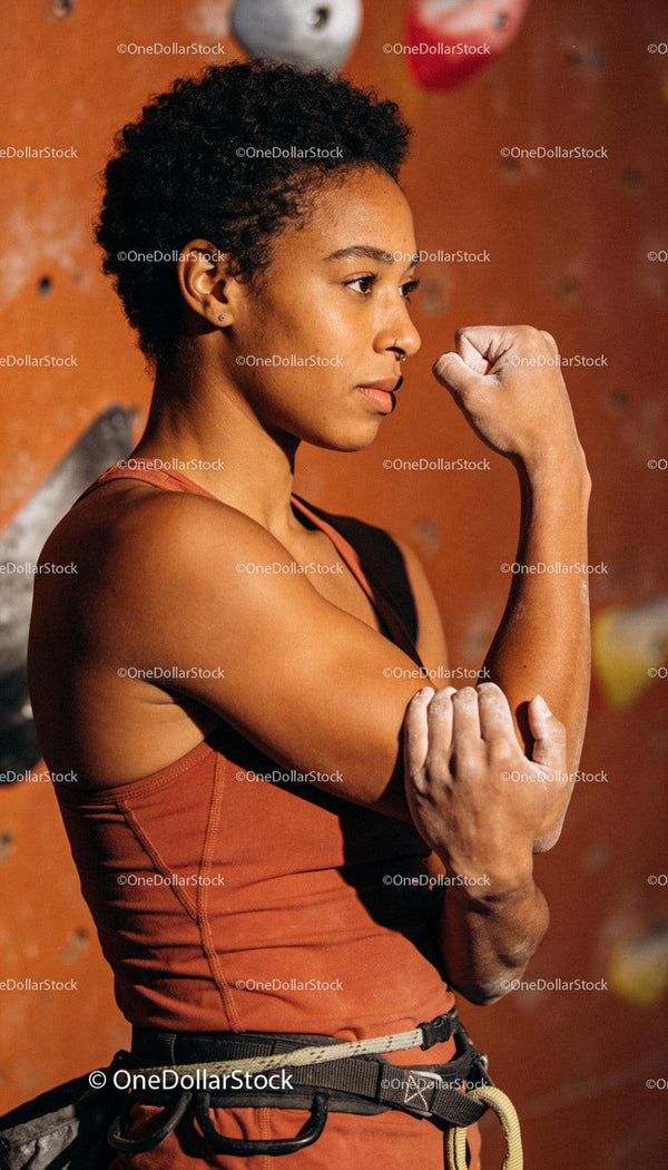 Focused rock climber preparing for indoor climb