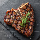 Juicy Grilled Beef Steak with Rosemary on Black Slate Plate