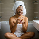 Young Woman Relaxing with Facial Mask in Modern Bathroom