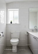 Bright Modern Bathroom with White Tiles and Frosted Window