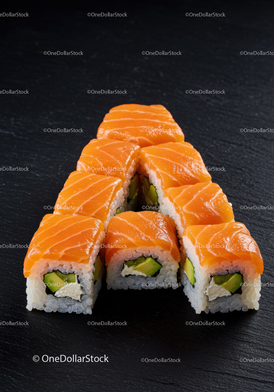 Fresh Salmon Sushi Rolls Arranged in Triangle Shape