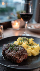 Gourmet Steak with Mashed Potatoes and Red Wine in Fine Dining Setting