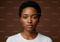 Portrait of a Young Black Woman with Freckles and Curly Hair in Studio