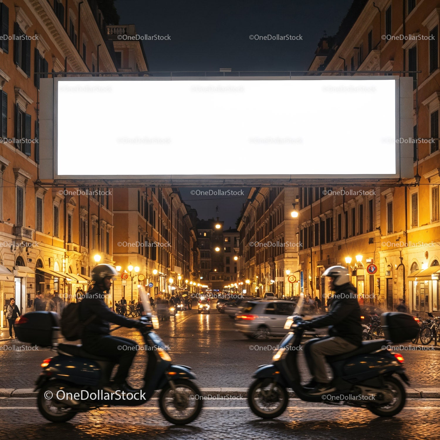 Nighttime urban street with scooters passing by