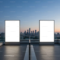 Empty illuminated billboards on urban rooftop at dusk