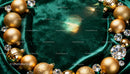 Golden Christmas ornaments on emerald velvet fabric