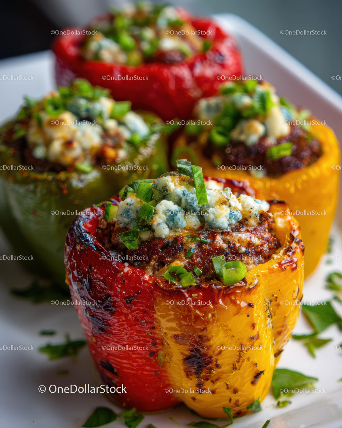 Colorful Stuffed Bell Peppers Grilled with Cheese and Fresh Herbs