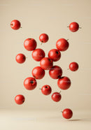 Fresh Red Apples Floating in Soft Beige Space