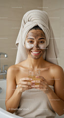 Woman with Facial Mask Holding Glass in Spa Setting
